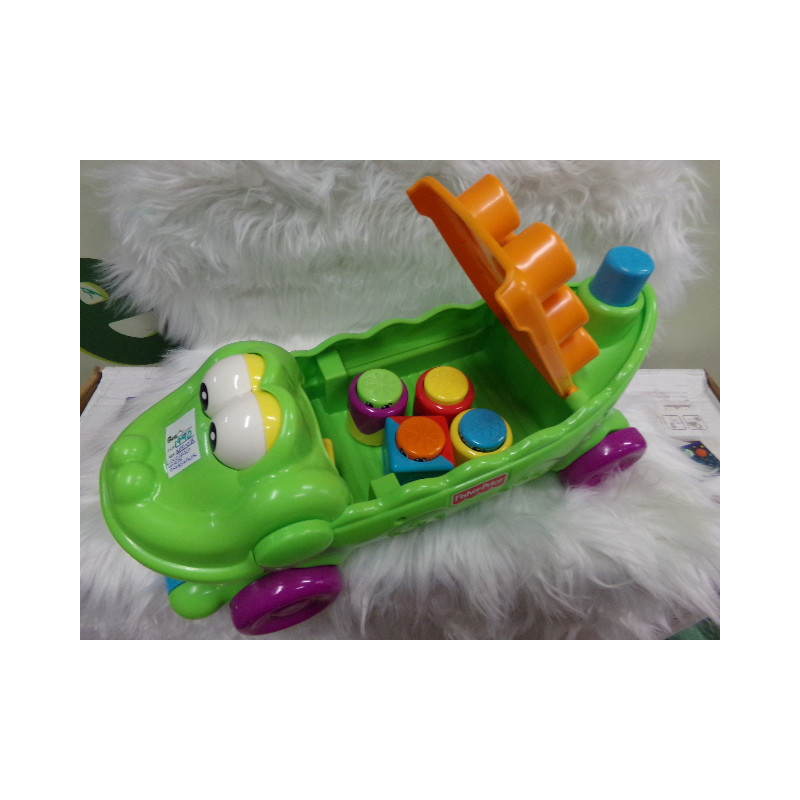 Cocodrilo musical con ruedas y piezas encajables Fisher Price. Segunda mano.
