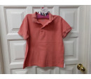 Polo naranja m/c 8-10años. Segunda mano.