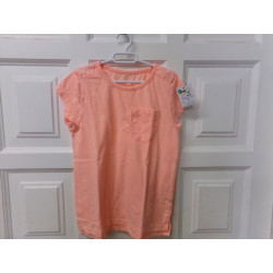 Camiseta  naranja talla 7 años. Segunda mano