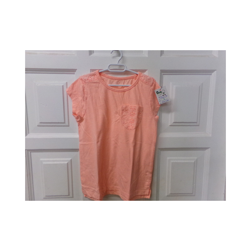 Camiseta  naranja talla 7 años. Segunda mano